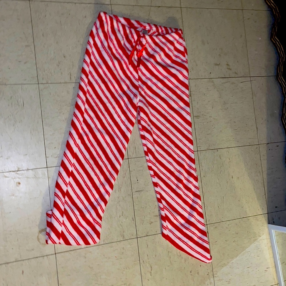 I’m selling candy cane fuzzy sweat pants.